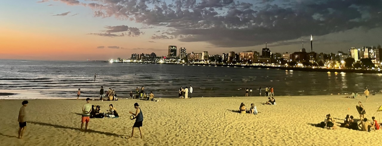 People on beach at night in Montevideo Uruguay